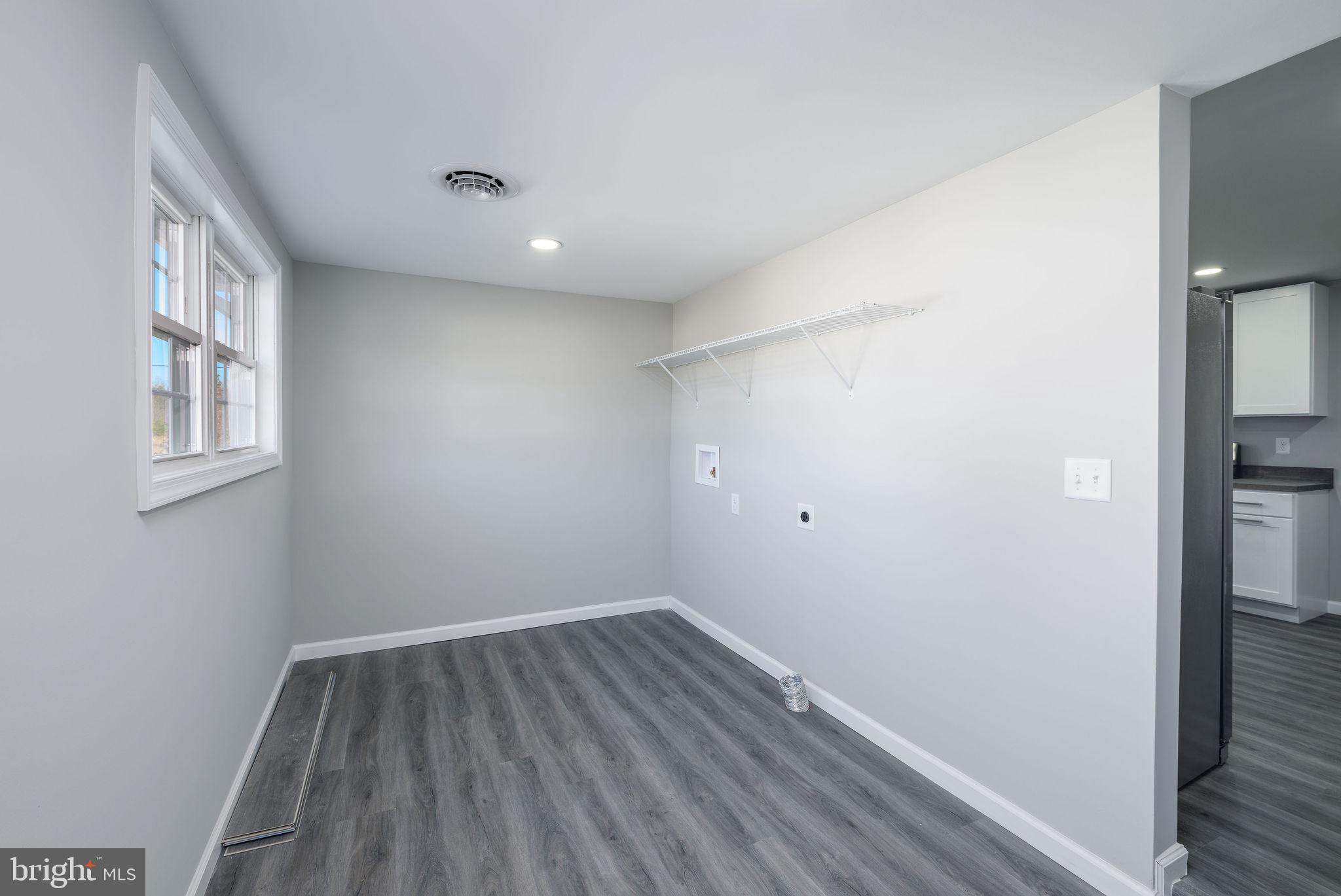 24532 Deep Branch Road Georgetown, DE 19947 - Photo 27 of 43 a view of room with window and wooden floor