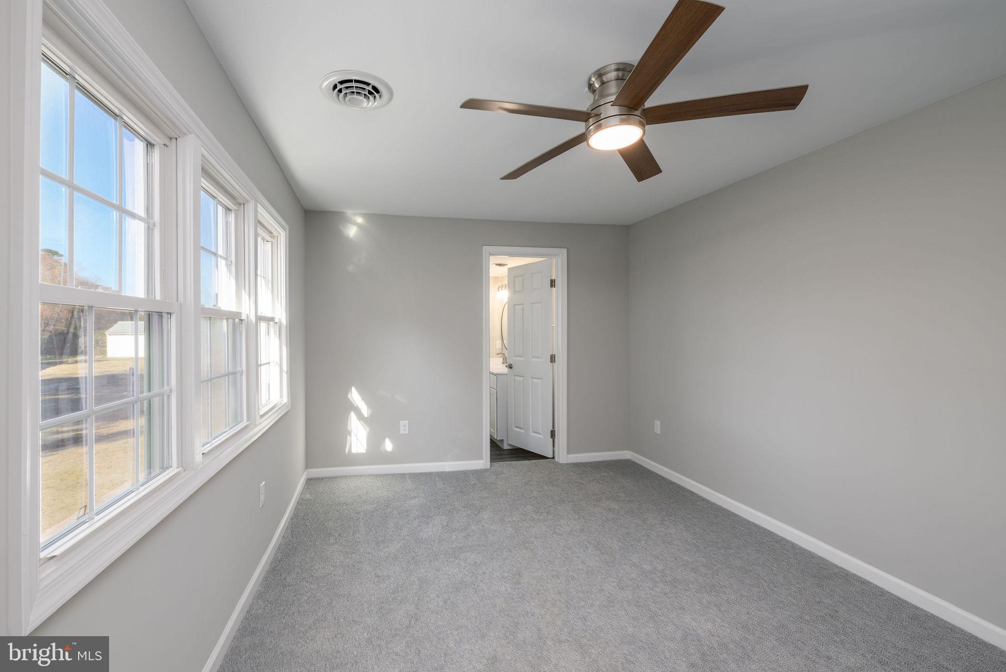 24532 Deep Branch Road Georgetown, DE 19947 - Photo 29 of 43 a view of an empty room with a window