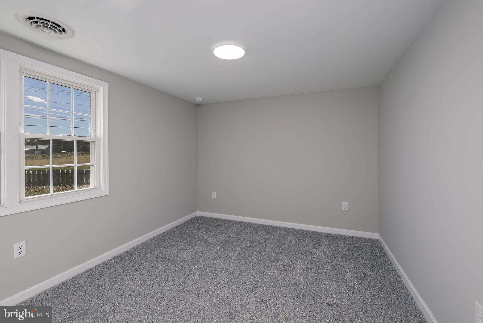 24532 Deep Branch Road Georgetown, DE 19947 - Photo 32 of 43 an empty room with a window