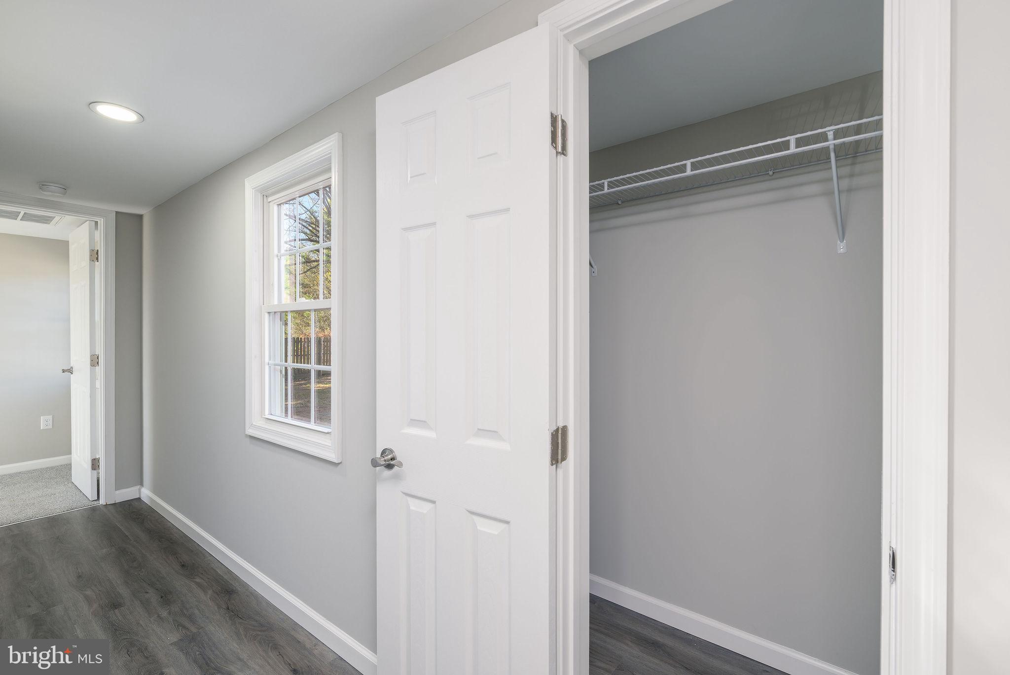 24532 Deep Branch Road Georgetown, DE 19947 - Photo 34 of 43 a view of an empty room with wooden floor and a window