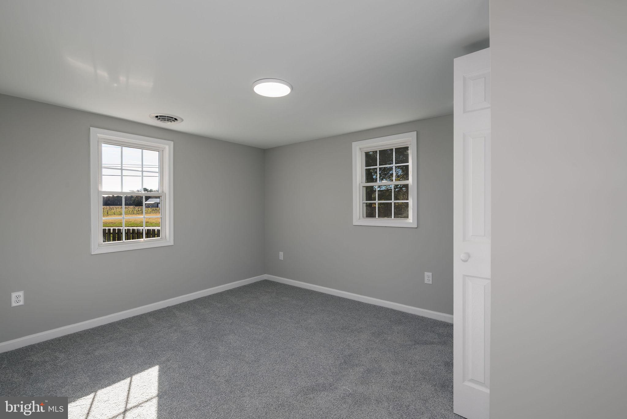 24532 Deep Branch Road Georgetown, DE 19947 - Photo 35 of 43 an empty room with windows
