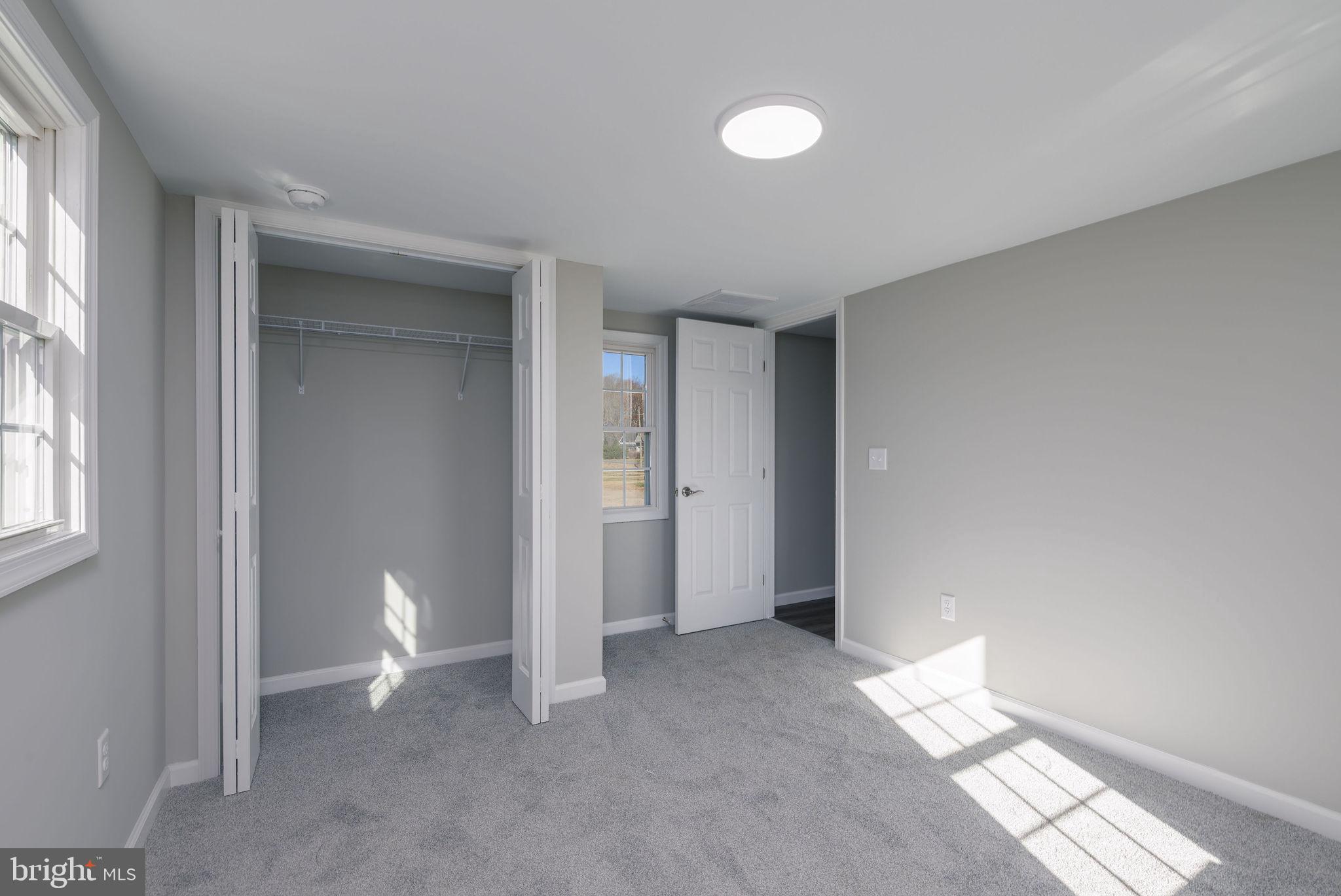 24532 Deep Branch Road Georgetown, DE 19947 - Photo 36 of 43 a view of a room with wooden floor and windows