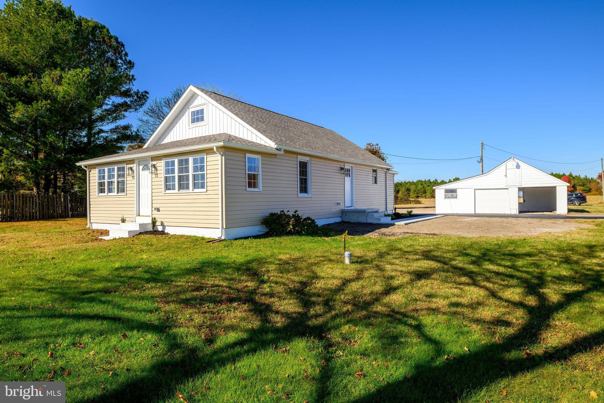 24532 Deep Branch Road Georgetown, DE 19947 - Photo 38 of 43 a front view of a house with a yard