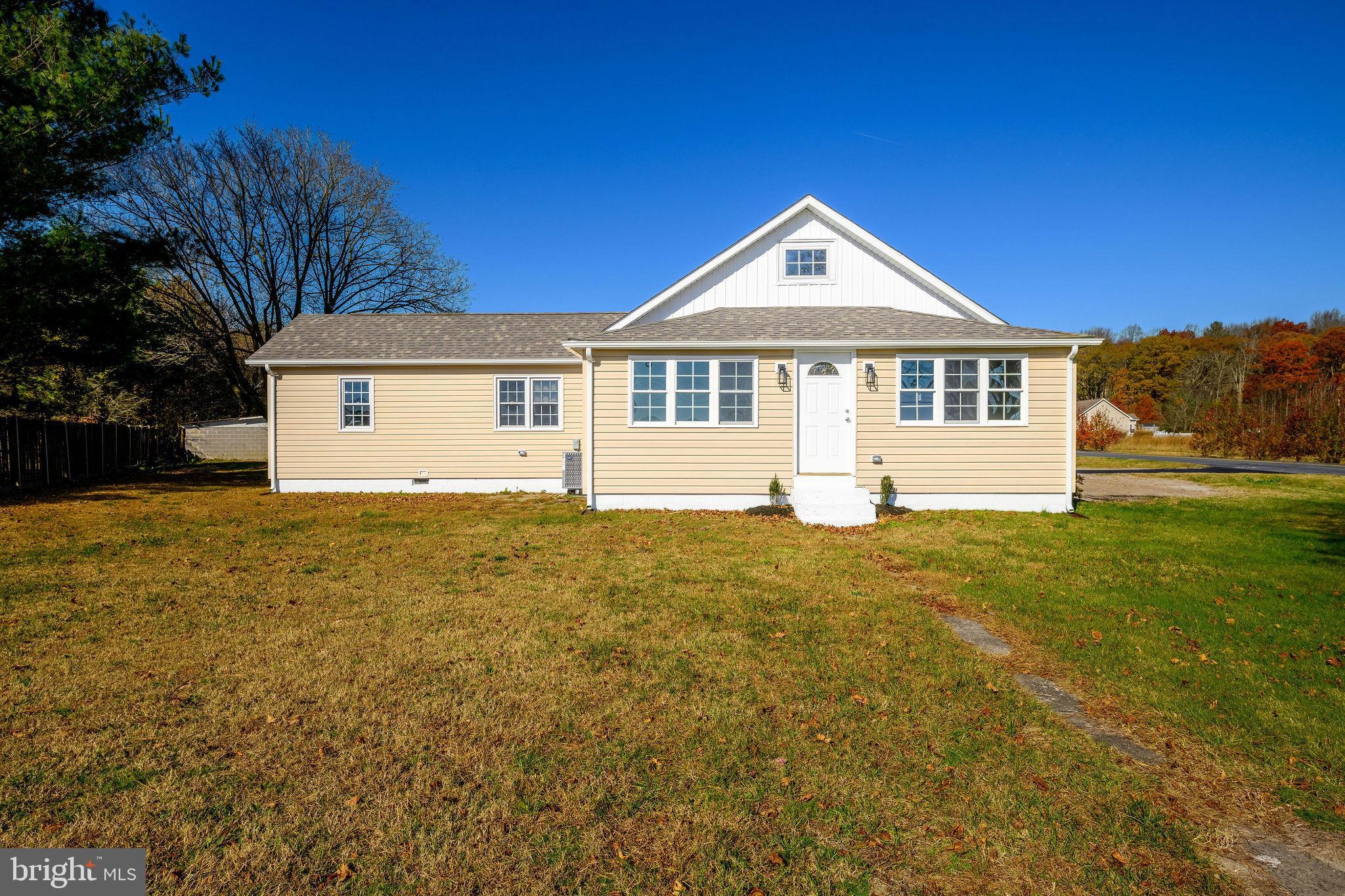 24532 Deep Branch Road Georgetown, DE 19947 - Photo 39 of 43 a front view of a house with a yard