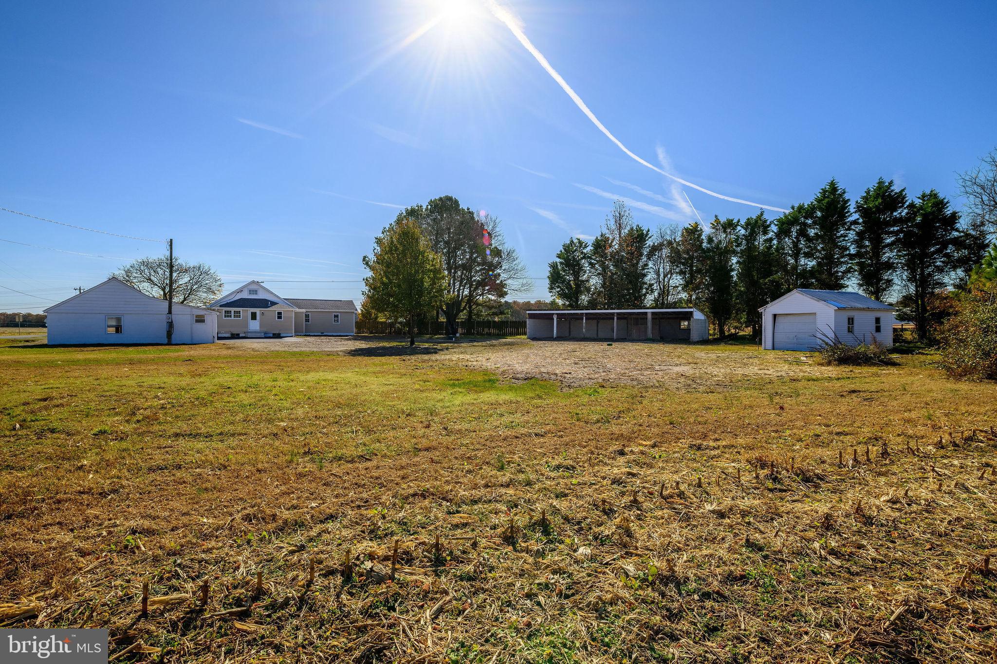 24532 Deep Branch Road Georgetown, DE 19947 - Photo 42 of 43 a view of a swimming pool with an outdoor space and seating area