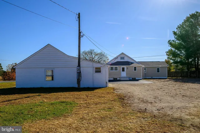 a house that has a wooden fence