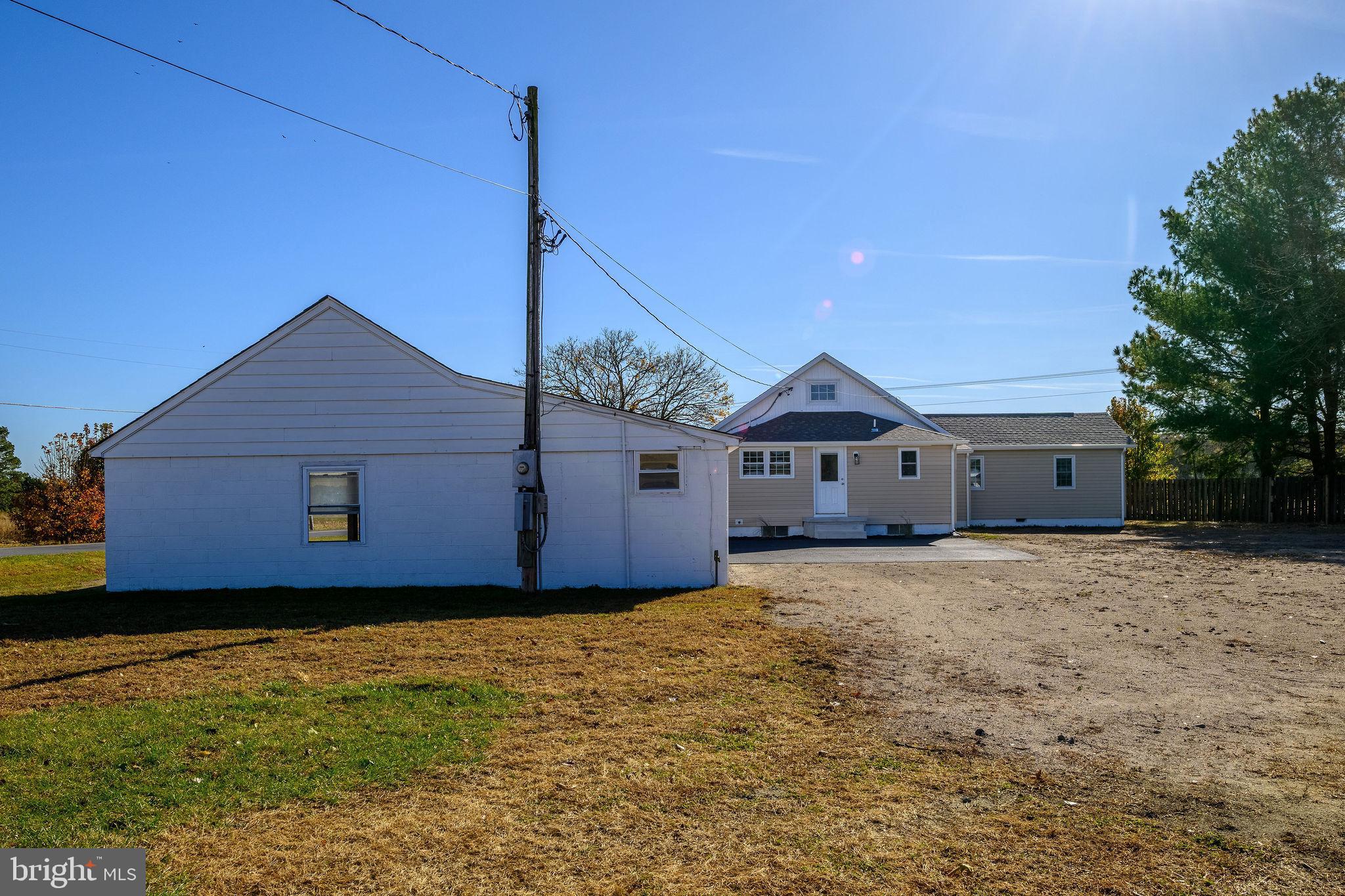 24532 Deep Branch Road Georgetown, DE 19947 - Photo 43 of 43 a house that has a wooden fence
