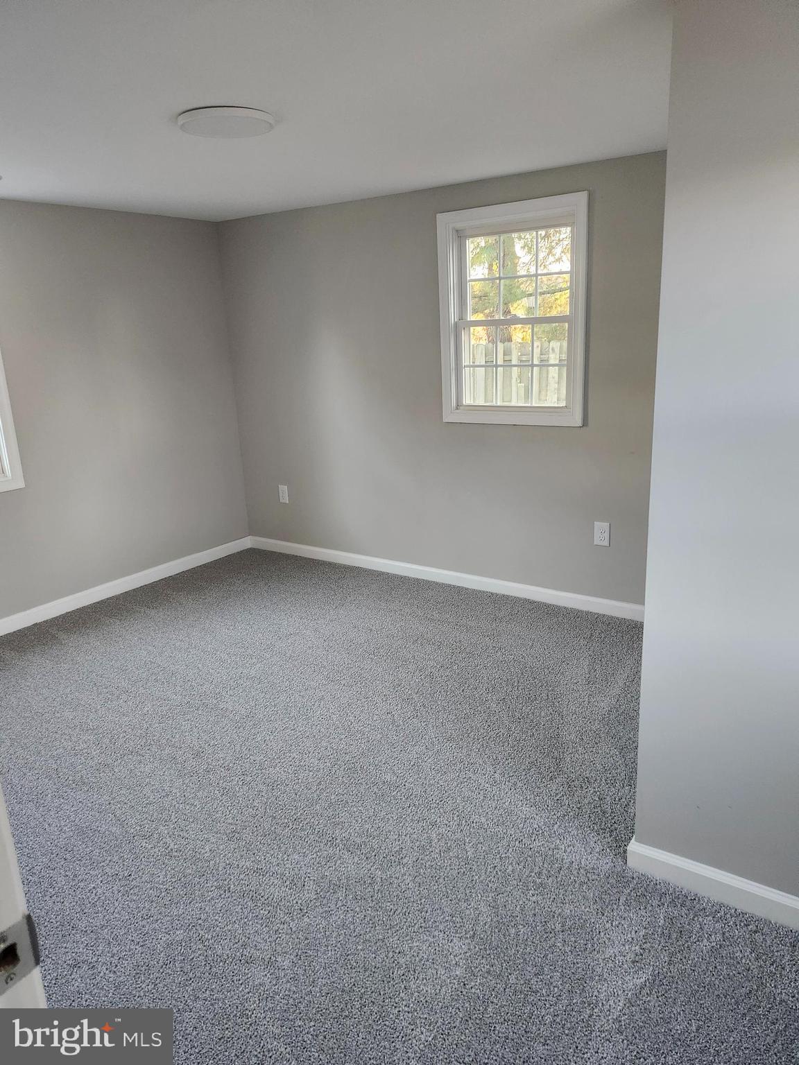 24532 Deep Branch Road Georgetown, DE 19947 - Photo 8 of 43 an empty room with windows