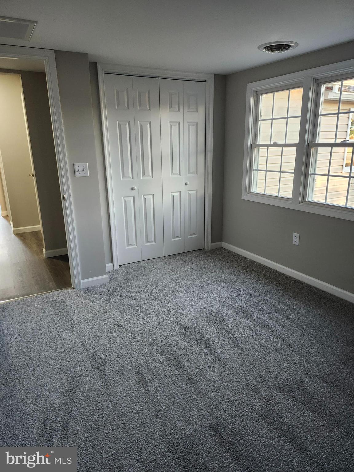 24532 Deep Branch Road Georgetown, DE 19947 - Photo 10 of 43 an empty room with windows