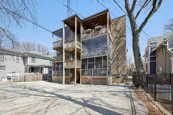 a view of garage and wooden fence