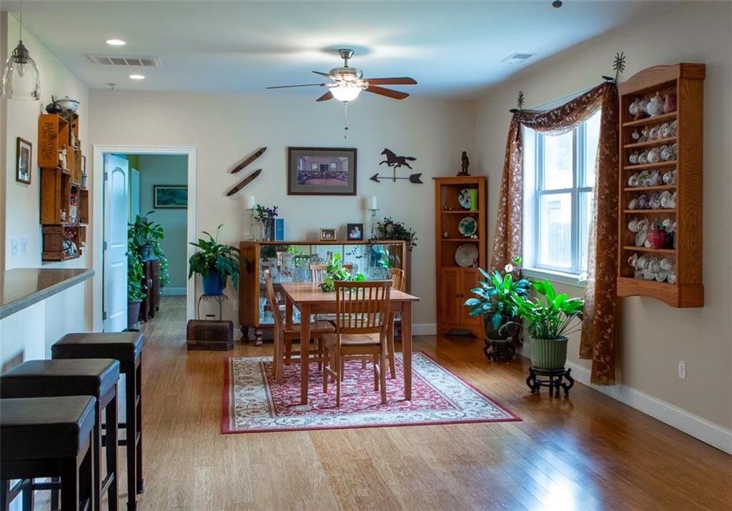 708 Sheep Pasture Road Commerce, GA 30529 - Photo 16 of 35 a living room with furniture and a potted plant