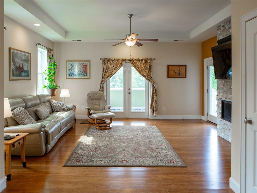 708 Sheep Pasture Road Commerce, GA 30529 - Photo 17 of 35 a living room with furniture and a fireplace