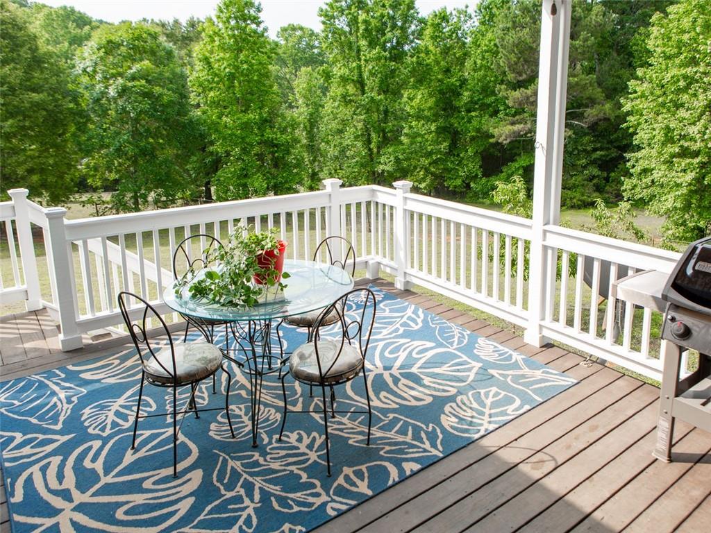 708 Sheep Pasture Road Commerce, GA 30529 - Photo 20 of 35 a view of a chairs on wooden deck