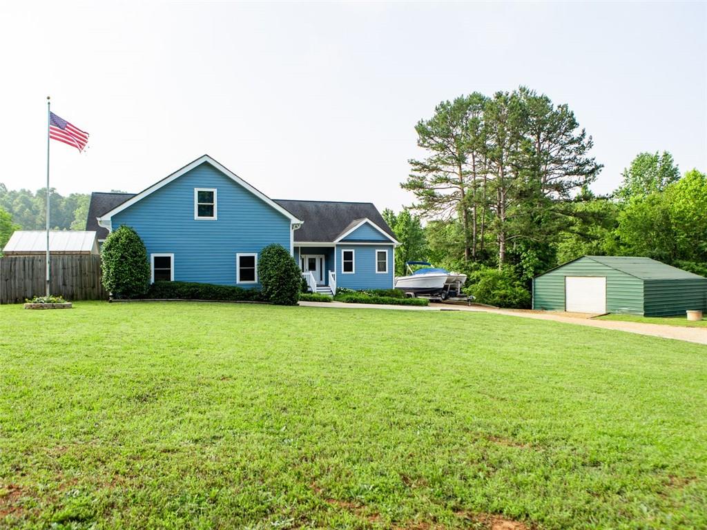 708 Sheep Pasture Road Commerce, GA 30529 - Photo 2 of 35 a house view with a garden space