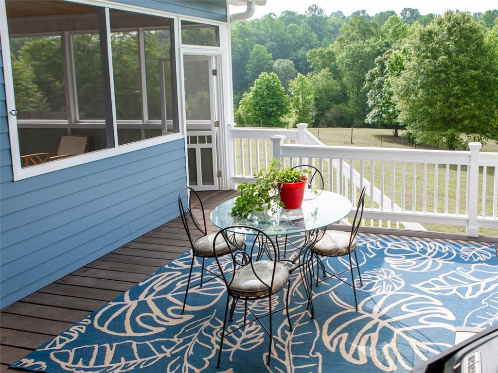 708 Sheep Pasture Road Commerce, GA 30529 - Photo 21 of 35 a view of a chairs and table on the balcony