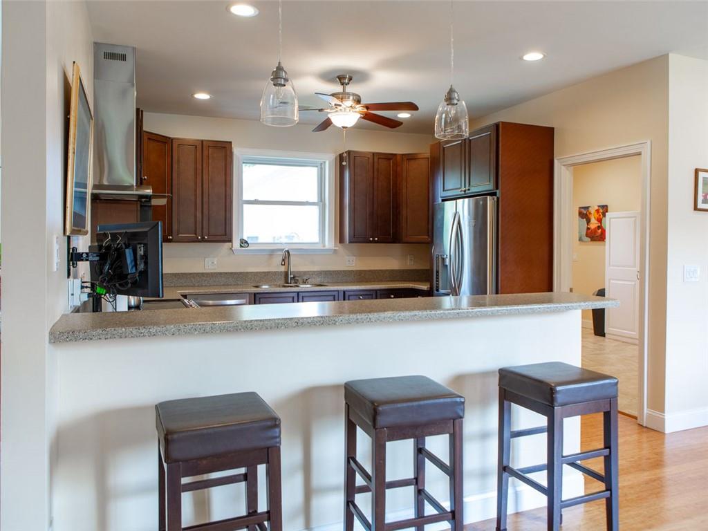 708 Sheep Pasture Road Commerce, GA 30529 - Photo 23 of 35 a kitchen with a table chairs refrigerator and microwave