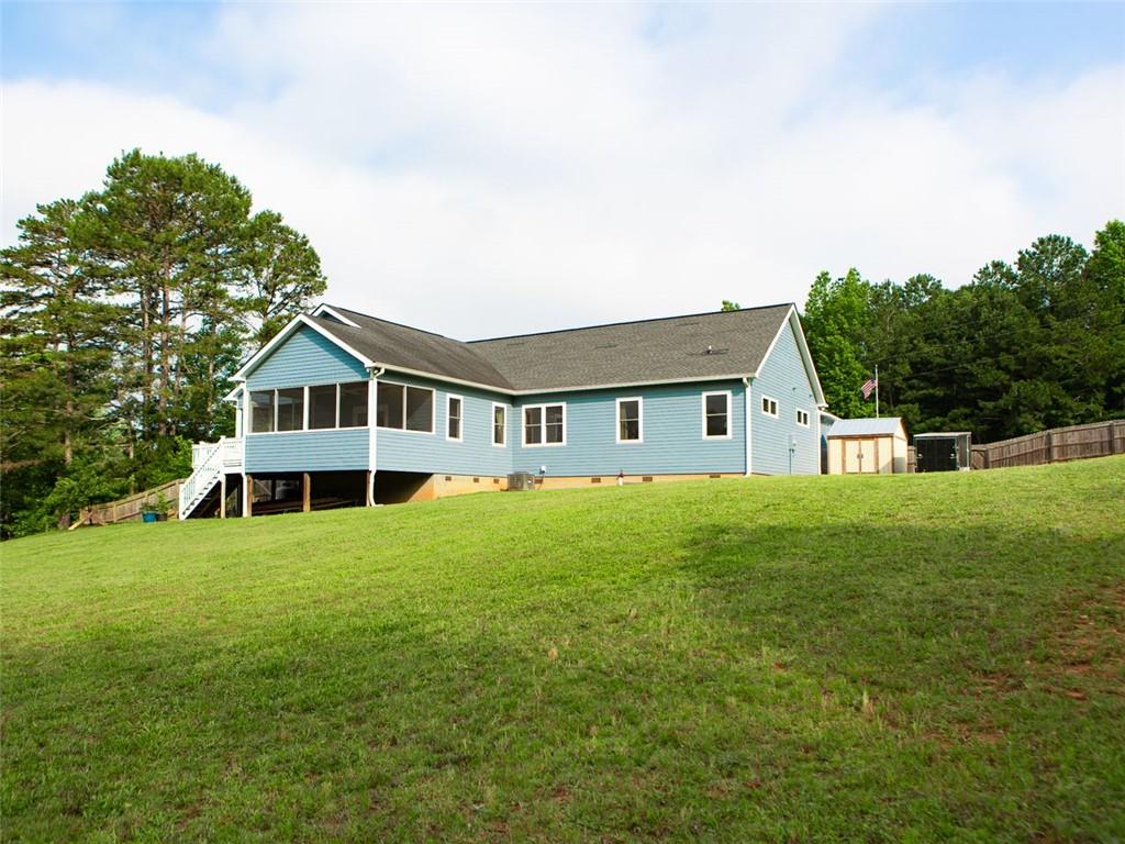708 Sheep Pasture Road Commerce, GA 30529 - Photo 4 of 35 a house with swimming pool in front of it