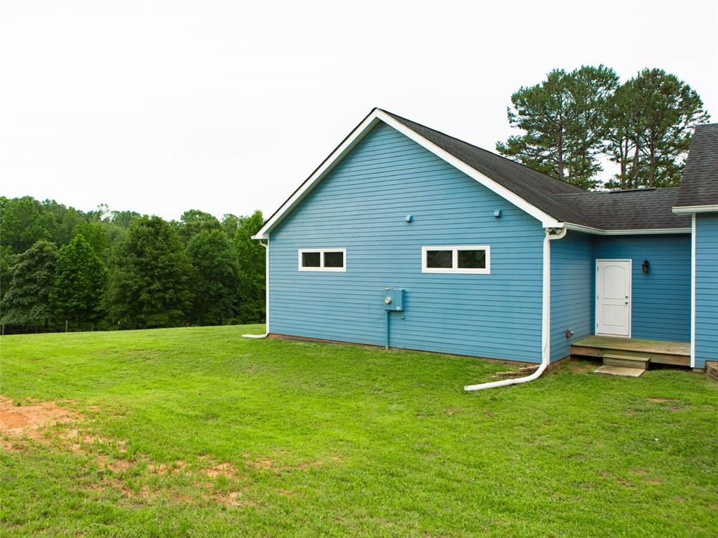 708 Sheep Pasture Road Commerce, GA 30529 - Photo 5 of 35 a view of a backyard with a garden