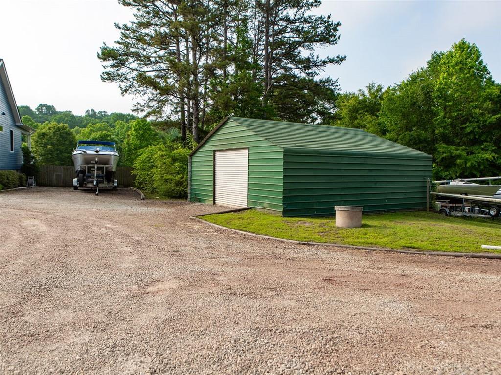 708 Sheep Pasture Road Commerce, GA 30529 - Photo 7 of 35 a view of a house with backyard and trees