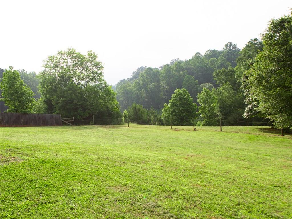 708 Sheep Pasture Road Commerce, GA 30529 - Photo 10 of 35 a view of an outdoor space and a yard