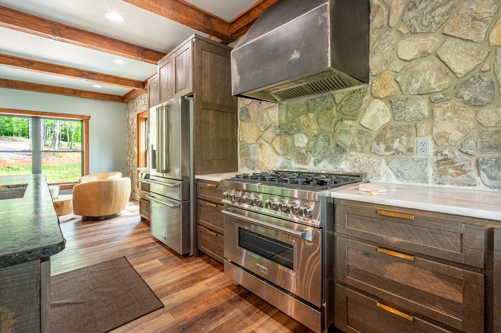 1220 Sunset Road Epworth, GA 30541 - Photo 11 of 46 a kitchen with stainless steel appliances granite countertop a stove and a refrigerator