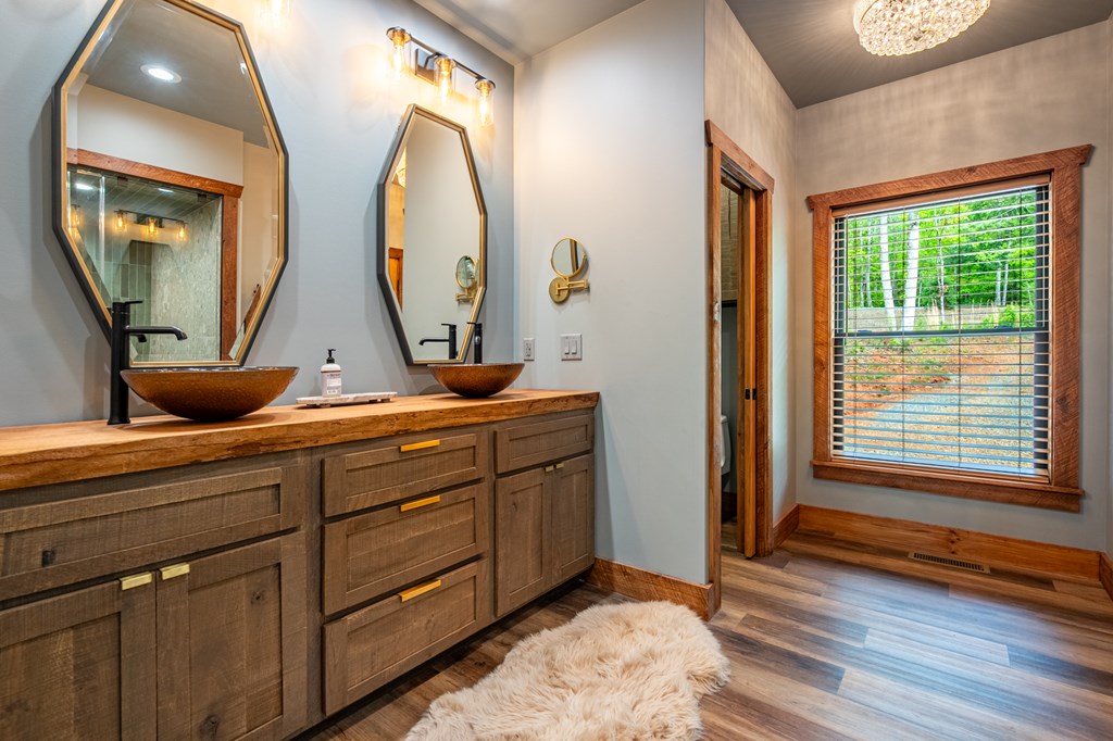 1220 Sunset Road Epworth, GA 30541 - Photo 18 of 46 a room with two mirror and dresser