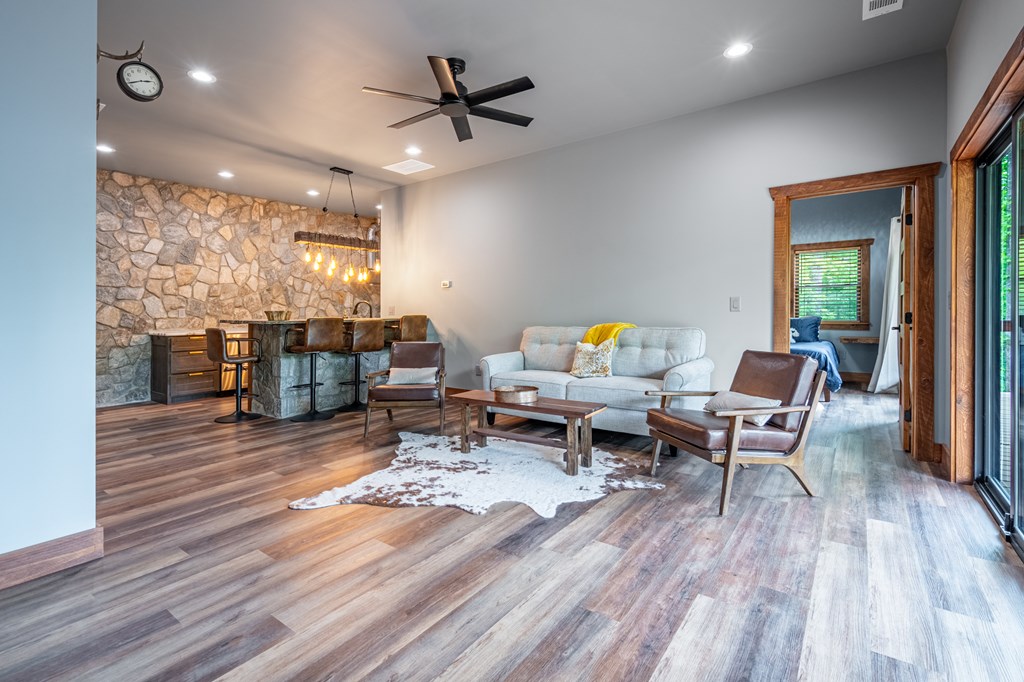 1220 Sunset Road Epworth, GA 30541 - Photo 27 of 46 a living room with furniture and wooden floor