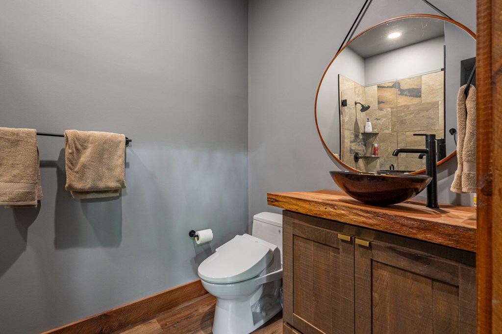 1220 Sunset Road Epworth, GA 30541 - Photo 36 of 46 a bathroom with a toilet and a mirror