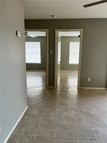 a view of hallway with chandelier