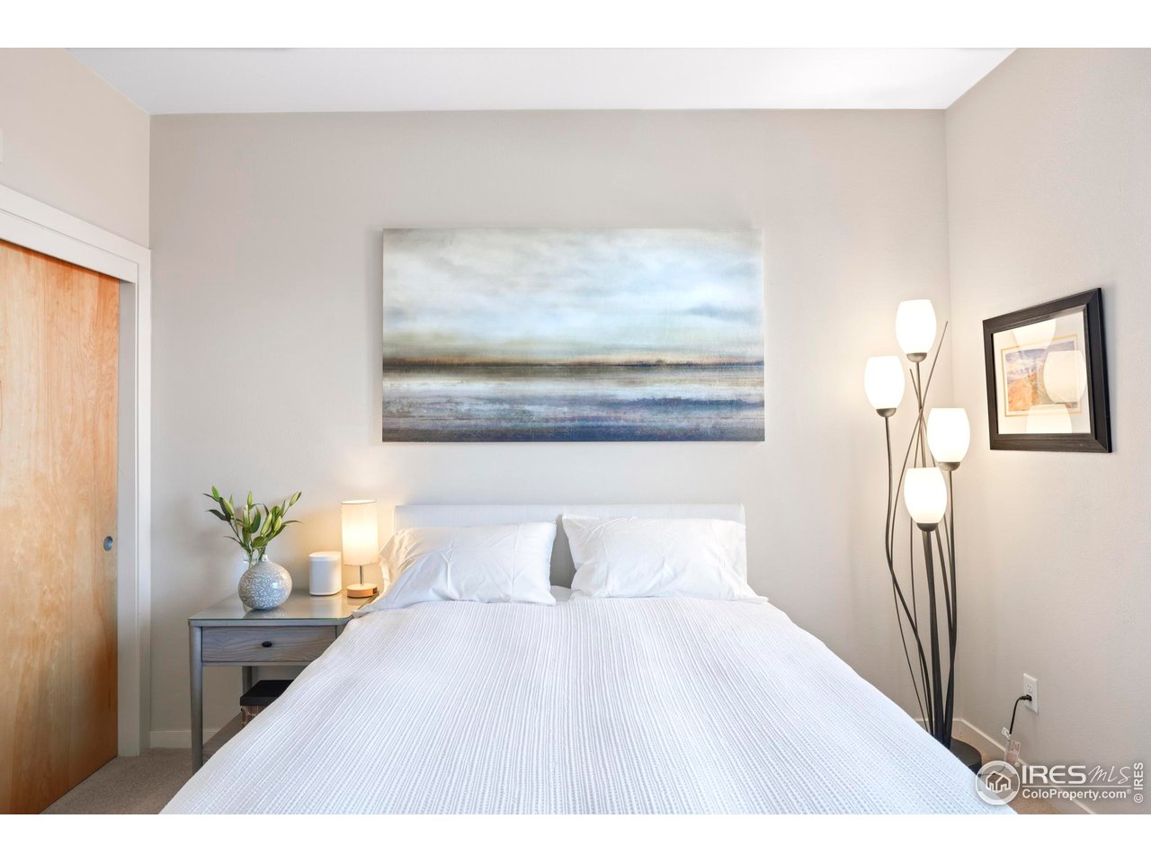 4190 Longview Lane Boulder, CO 80301 - Photo 12 of 29 a bedroom with a bed and a painting on the wall