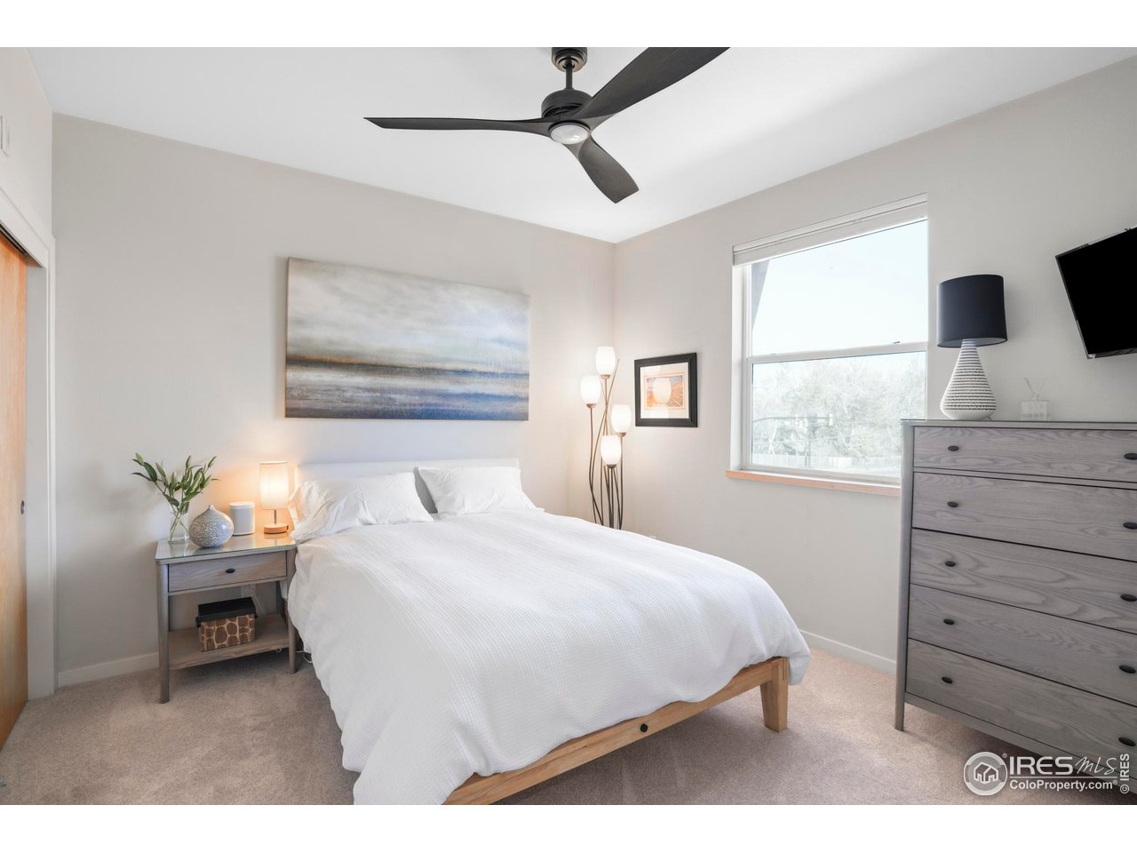 4190 Longview Lane Boulder, CO 80301 - Photo 13 of 29 a bedroom with a bed and a flat screen tv