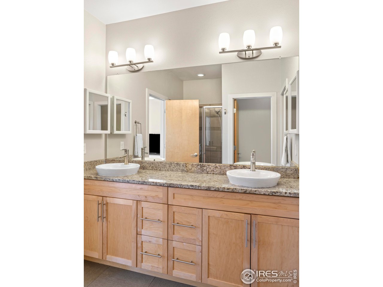 4190 Longview Lane Boulder, CO 80301 - Photo 19 of 29 a bathroom with a granite countertop sink and a mirror