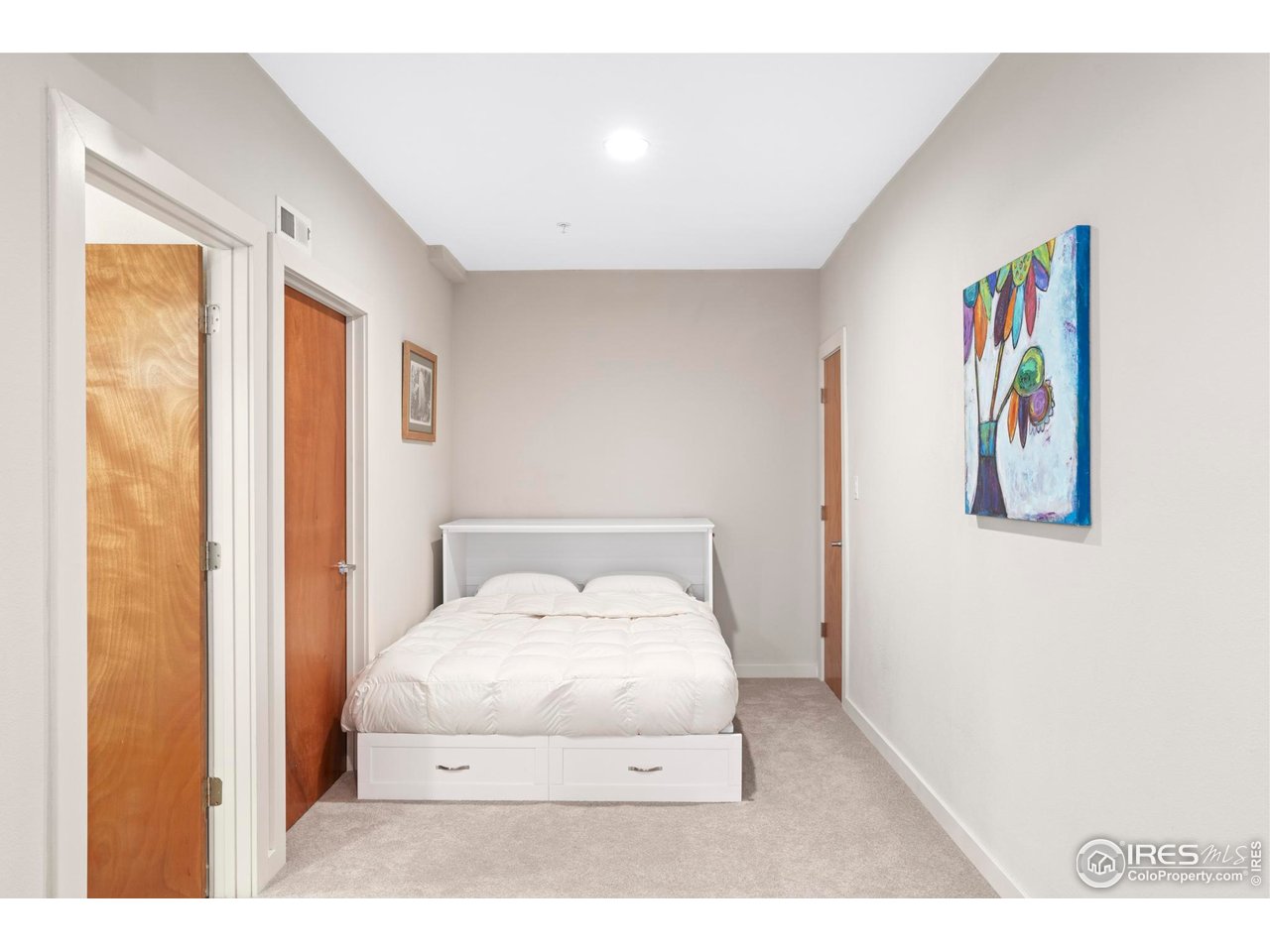 4190 Longview Lane Boulder, CO 80301 - Photo 22 of 29 a room with a bed and painting on the wall
