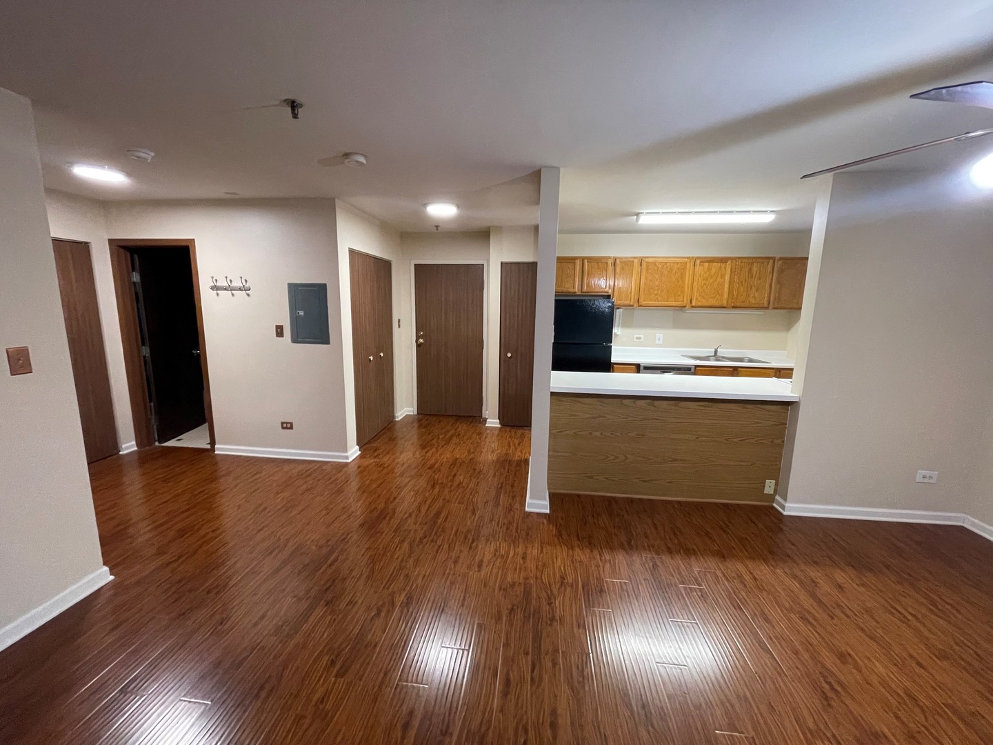 3265 Kirchoff Road, Unit 121 Rolling Meadows, IL 60008 - Photo 6 of 14 a view of a kitchen with wooden floor and electronic appliances