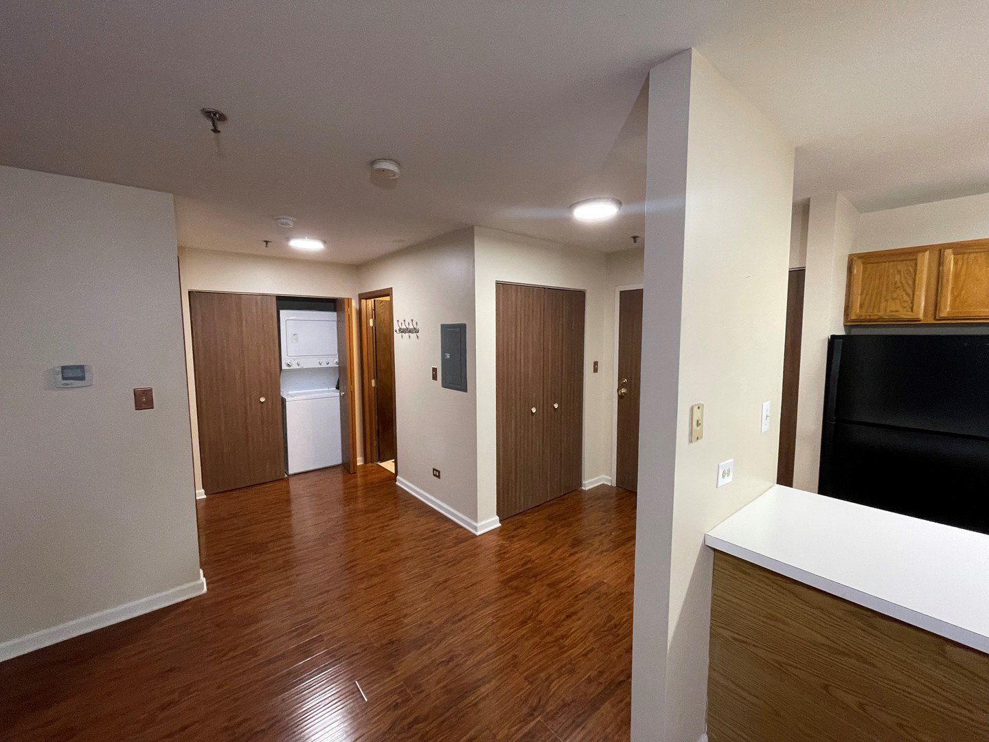 3265 Kirchoff Road, Unit 121 Rolling Meadows, IL 60008 - Photo 7 of 14 a view of hallway with wooden floor