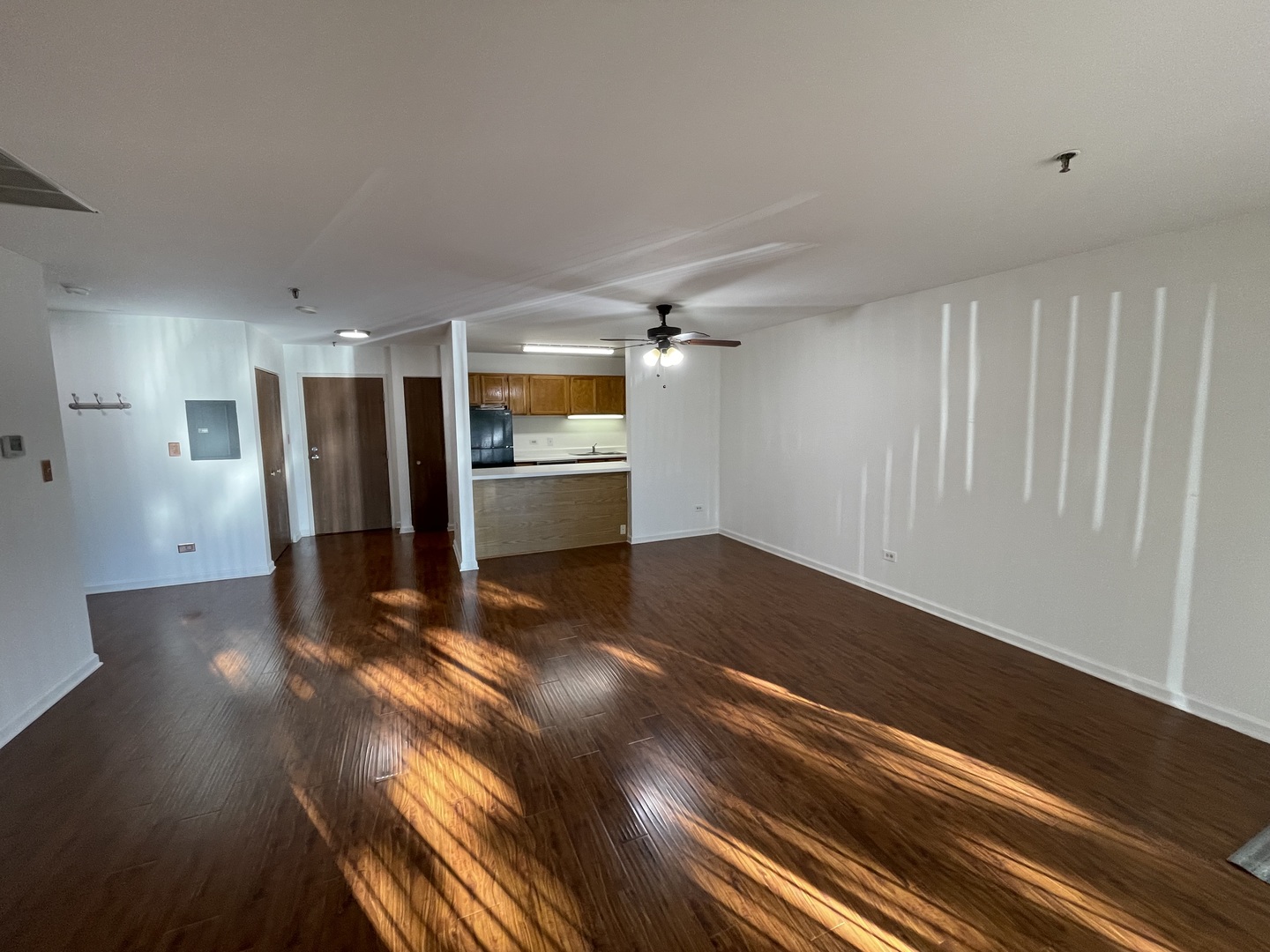 3265 Kirchoff Road, Unit 121 Rolling Meadows, IL 60008 - Photo 8 of 14 a view of empty room with wooden floor