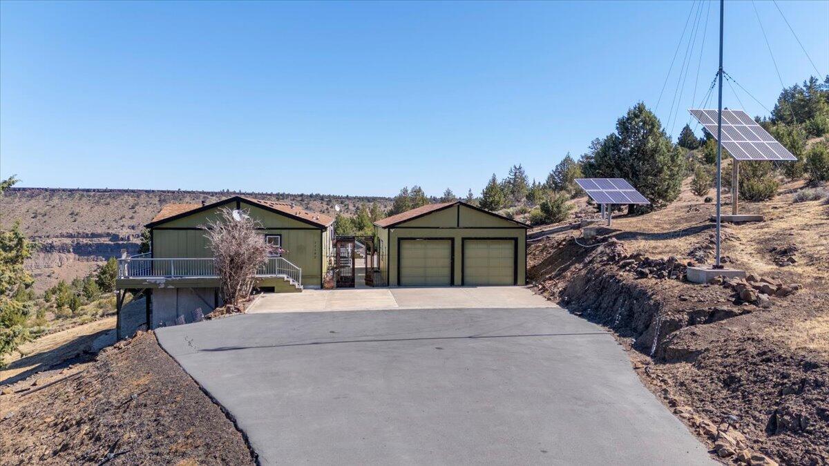 11182 Southwest Dynamite Lane Culver, OR 97734 - Photo 58 of 70 a front view of a house with a yard