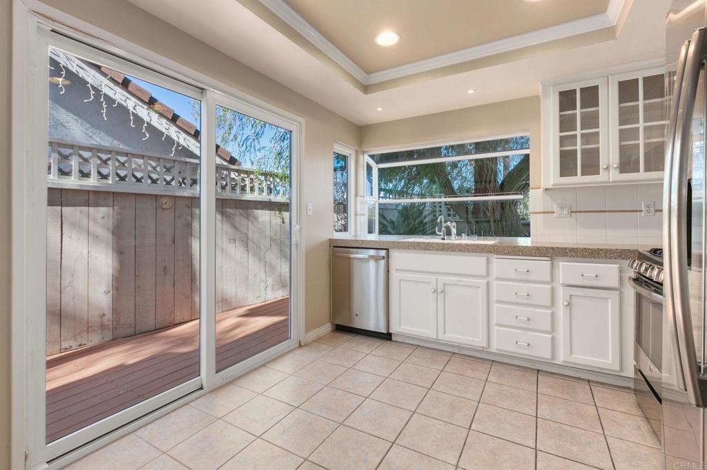 1521 Flair Encinitas Drive Encinitas, CA 92024 - Photo 11 of 45 a kitchen with a cabinets and window