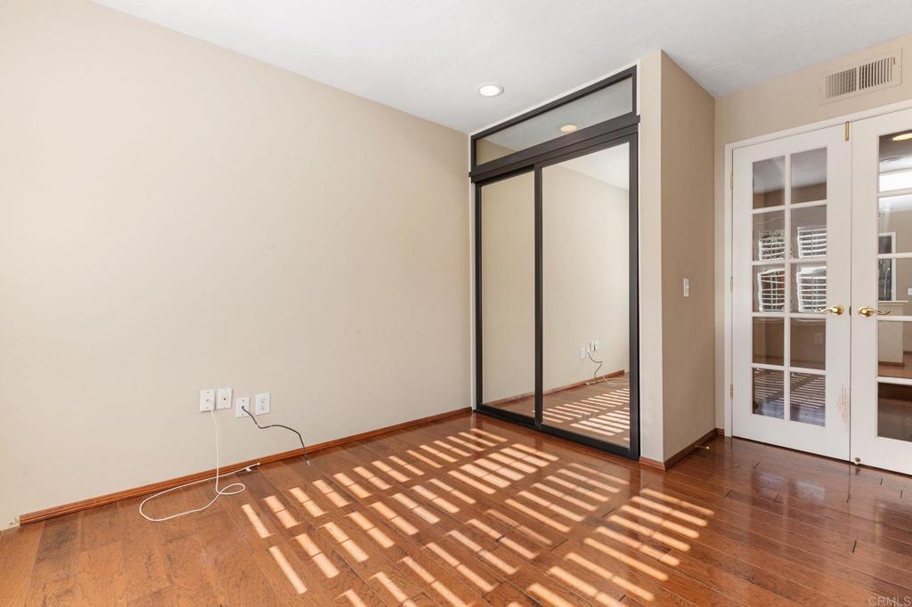 1521 Flair Encinitas Drive Encinitas, CA 92024 - Photo 14 of 45 a view of empty room with wooden floor and fan