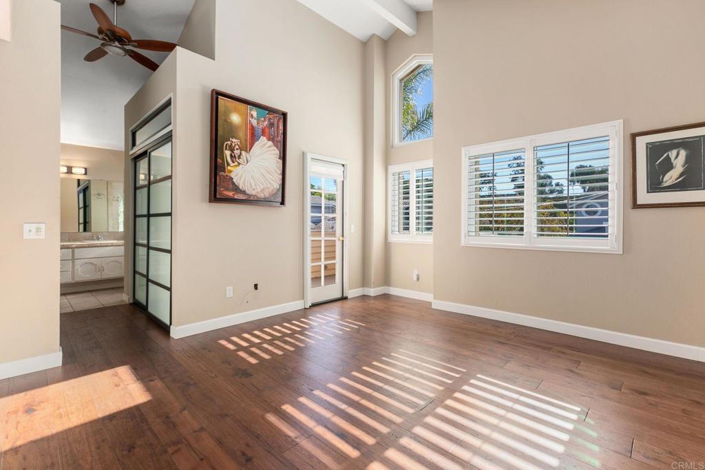 1521 Flair Encinitas Drive Encinitas, CA 92024 - Photo 18 of 45 a view of a big room with wooden floor and windows