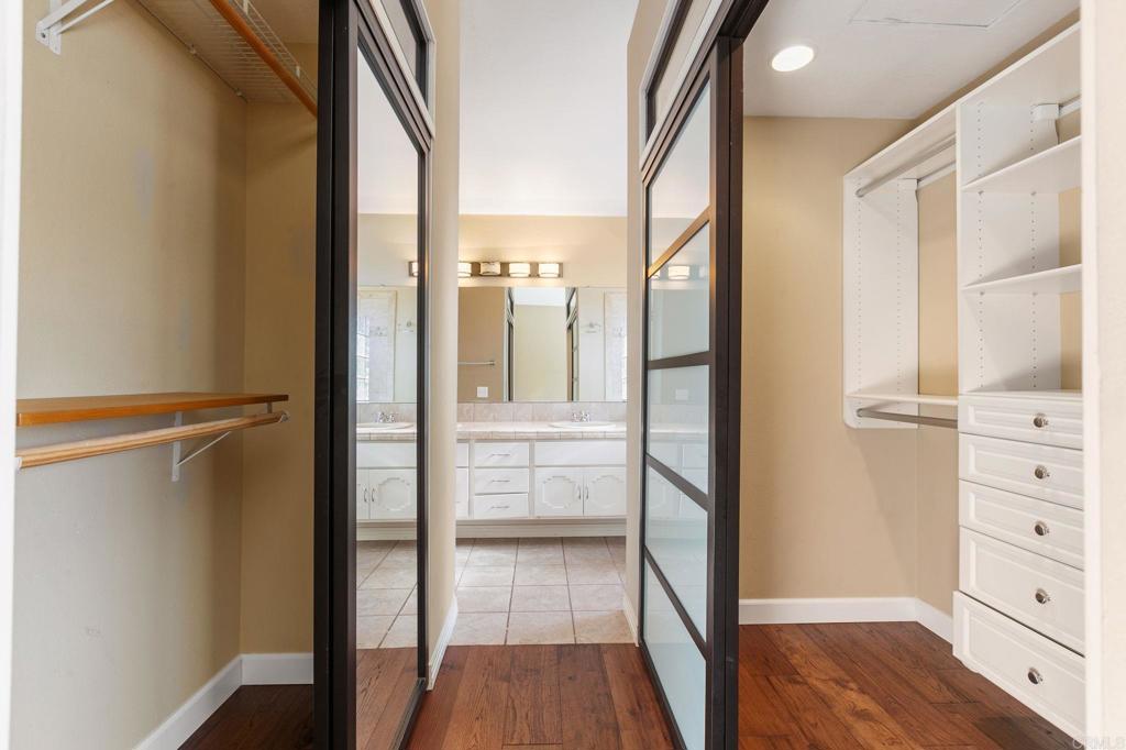 1521 Flair Encinitas Drive Encinitas, CA 92024 - Photo 19 of 45 a view of walk in closet with empty racks