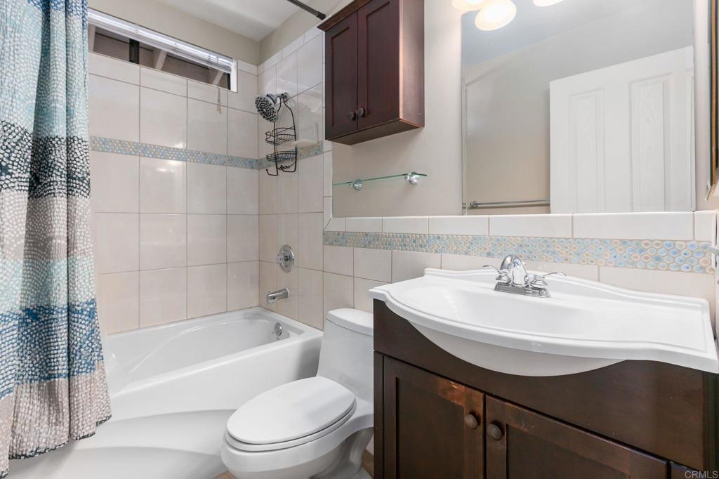 1521 Flair Encinitas Drive Encinitas, CA 92024 - Photo 25 of 45 a bathroom with a sink a toilet and bathtub