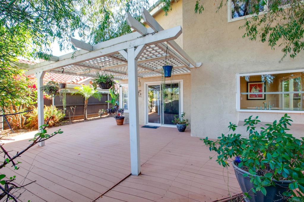 1521 Flair Encinitas Drive Encinitas, CA 92024 - Photo 28 of 45 a view of a house with backyard and glass door