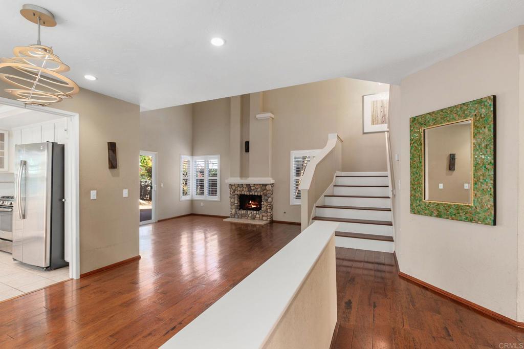 1521 Flair Encinitas Drive Encinitas, CA 92024 - Photo 5 of 45 a view of an entryway with wooden floor and stairs