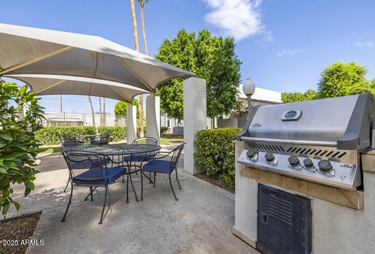 6505 East Osborn Road, Unit OFC Scottsdale, AZ 85251 - Photo 3 of 11 a view of an outdoor sitting area with a table and chair