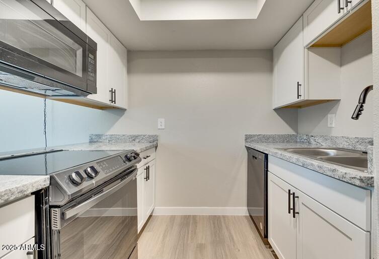 6505 East Osborn Road, Unit OFC Scottsdale, AZ 85251 - Photo 6 of 11 a kitchen with a stove and a sink