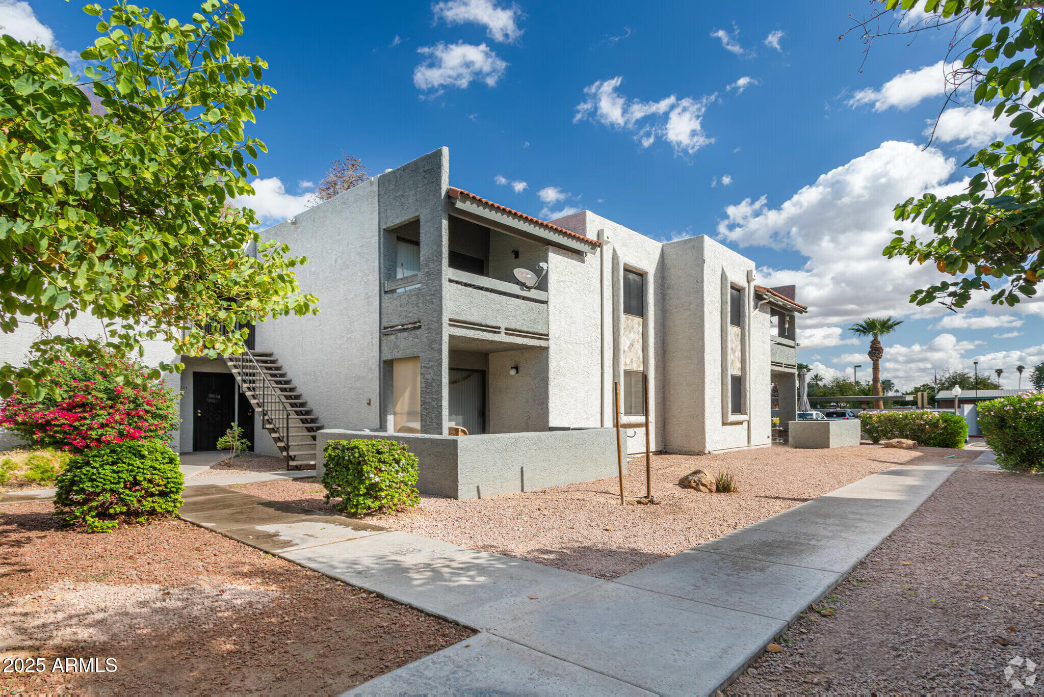 6505 East Osborn Road, Unit OFC Scottsdale, AZ 85251 - Photo 9 of 11 a front view of a house with a yard and a garage