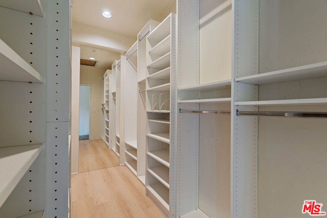 20912 Fontaine Road Topanga, CA 90290 - Photo 25 of 52 a view of walk in closet with empty racks