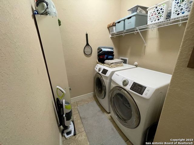 12310 Coal Mine Rise San Antonio, TX 78245 - Photo 17 of 19 a utility room with dryer and washer