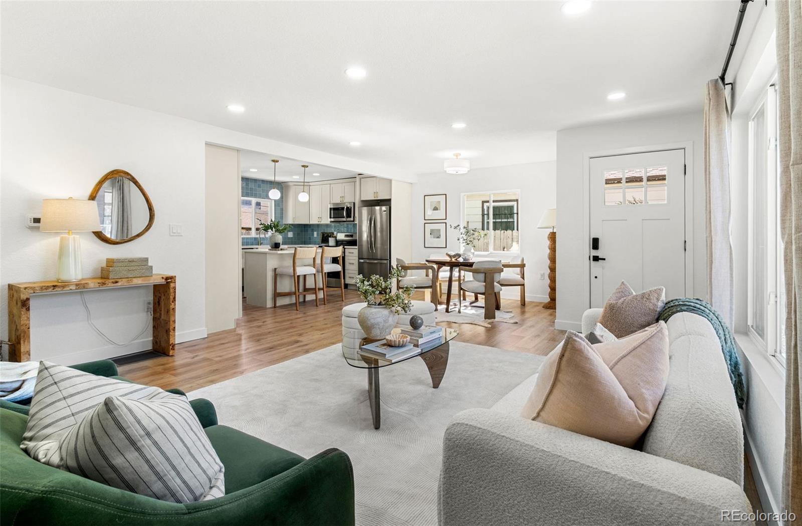 990 Tennyson Street Denver, CO 80204 - Photo 11 of 29 a living room with furniture and wooden floor